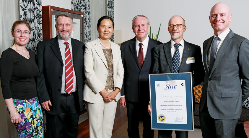 DMP Manager Ministerial Coordination Roz Marshall (left), Acting Deputy Director General Dr Rick Rogerson, Investment Promotion Manager Dr Gaomai Trench, the then Hon. Premier Colin Barnett, Acting Director General Dr Tim Griffin and former Minister for Mines and Petroleum Hon. Sean L’Estrange at the 2016 Premier’s Award presentation.