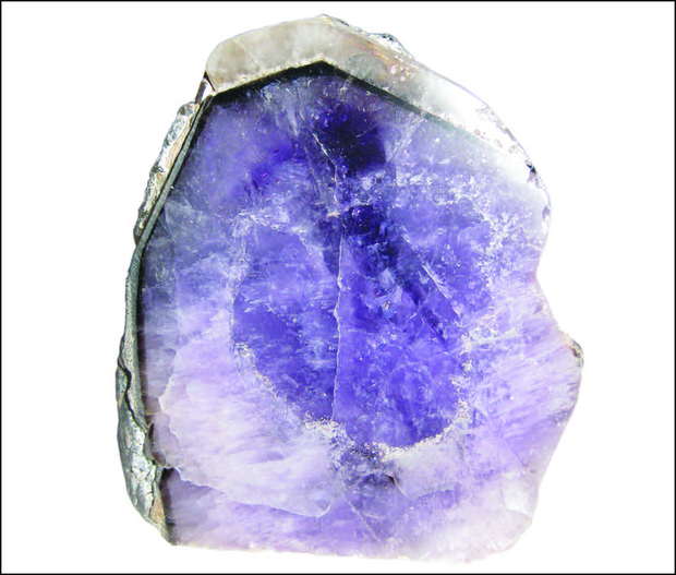 Zoned growth of an amethyst quartz crystal, which displays a sharply delineated, colourless border with contact planes marked by mineral inclusions; Wyloo area, Ashburton region (WA Museum, specimen 888)