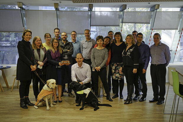 Volunteers from the department celebrate being named Guide Dogs WA Street Appeal Corporate Challenge winners.